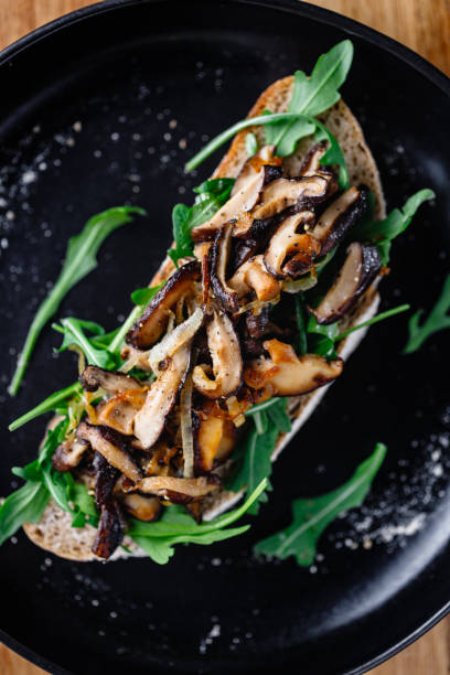 istock Vegan sandwich with fresh arugula, fried shiitake mushroom and shallot onion. 1211283761