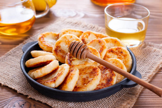 istock Cottage cheese pancakes with honey 1211285149