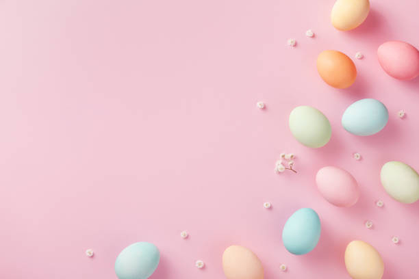 istock Easter eggs on pink pastel background top view. Modern flat lay style. 1211286391