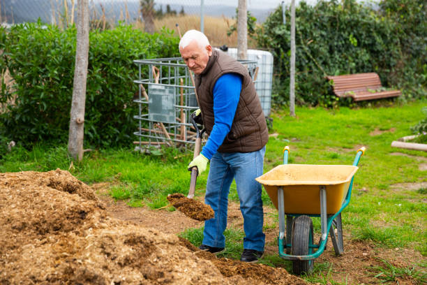 istock Senior man preparing manure for fertilizing land 1211287208