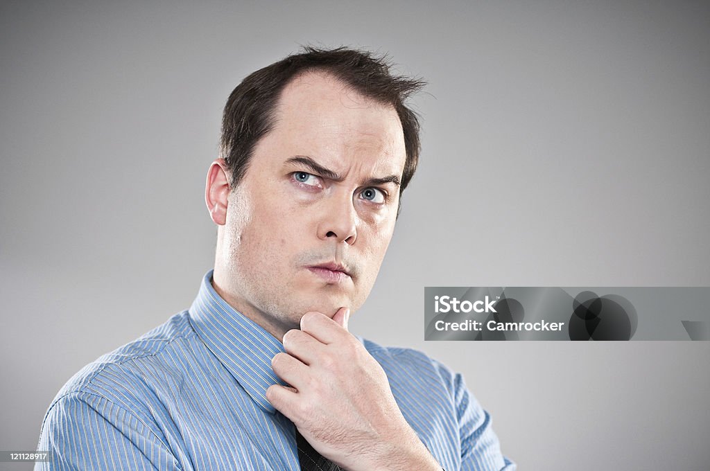 Pensive Young Man Portrait Royalty Free Stock image of a young professional man looking deep in thought.  30-34 Years Stock Photo