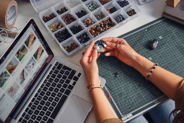 istock Girl is choosing nice shell for her jevellery 1211289812