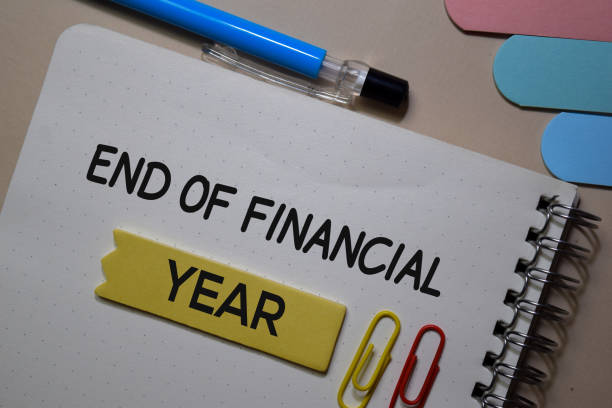 istock End of Financial write on a book isolated on Office Desk 1211291348