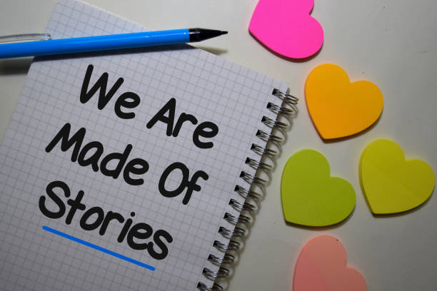 We Are Made of Stories write on a book isolated on Office Desk.