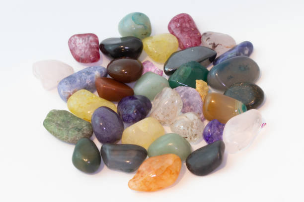 istock Bright colorful natural stones on a white background 1211291911