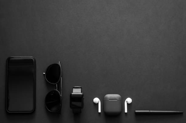 Men gadgets in modern lifestyle on dark background for minimalist flat lay black concept.