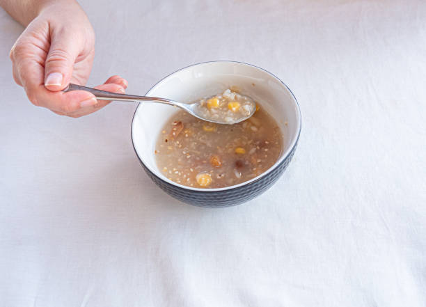 istock Traditional Turkish dessert ashure or Noah's Pudding with spoon on the table. 1211296192