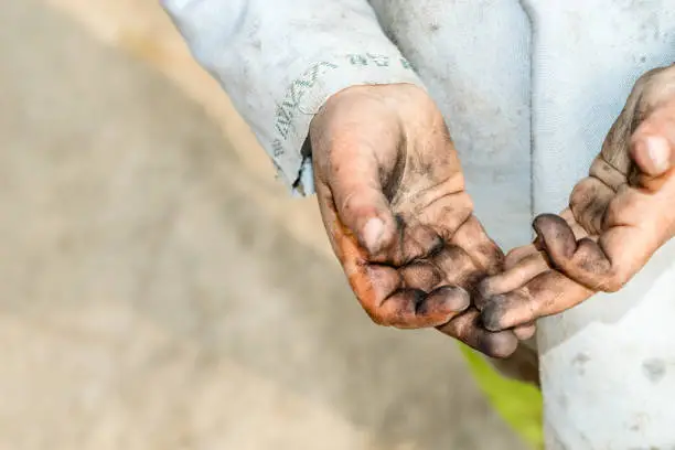 Photo of dirty hands and clothes of a child