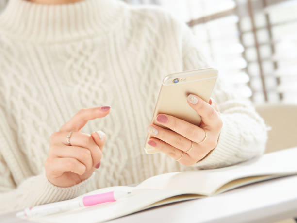 istock Woman operating a smartphone 1211299241
