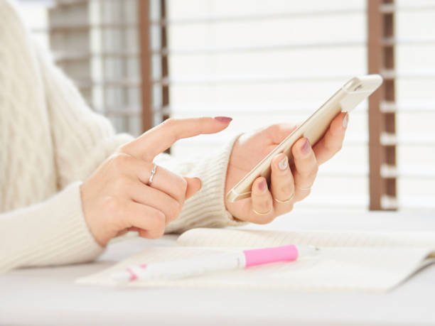 Woman operating a smartphone