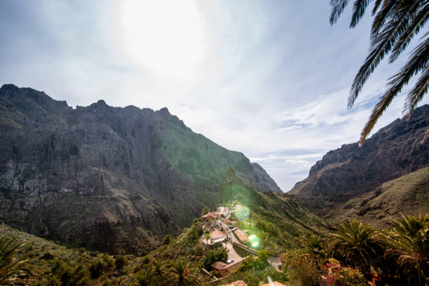 istock Aerial View from Masca, Masca viewpoint with Solar Flare and Sun Behind Clouds, Canary Island Tenerife, Spain - stock photo 1211299595