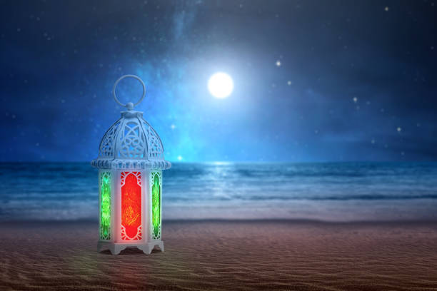 istock Arabic lamp with colorful light on the sandy beach 1211300778