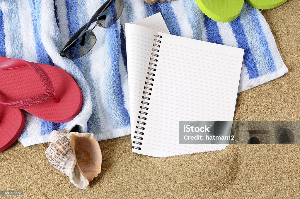 Beach background Beach background with towel, flip flops and blank notebook (studio shot - directional light and warm color are intentional).  To see my complete collection of beach scenes please  CLICK HERE.   Alternative file shown below: Beach Stock Photo