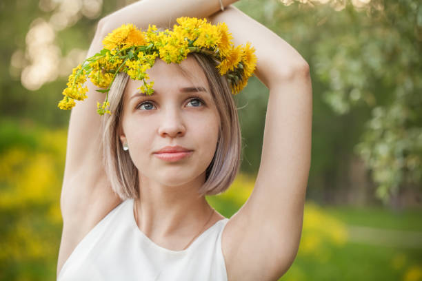 istock Young woman in spring park portrait 1211303322