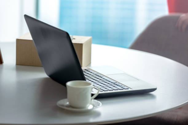 istock Laptop with a cup of coffee on the desk 1211307237