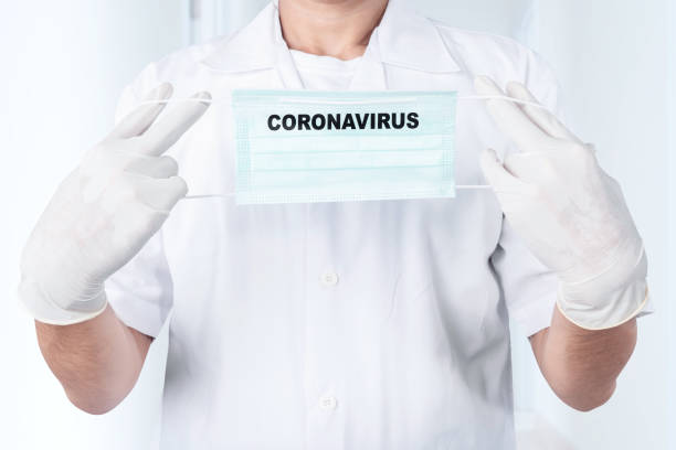 istock Man in protective gloves wearing a flu mask 1211307258