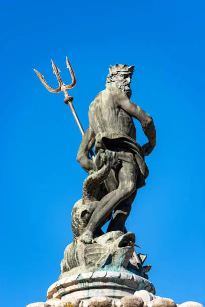 Closeup of the bronze statue of Neptune, Roman God, fountain in Piazza del Duomo (Cathedral square), Trento downtown, Trentino-Alto Adige, Italy, Europe