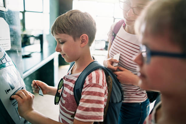 istock Children validating train tickets at the train station 1211308363