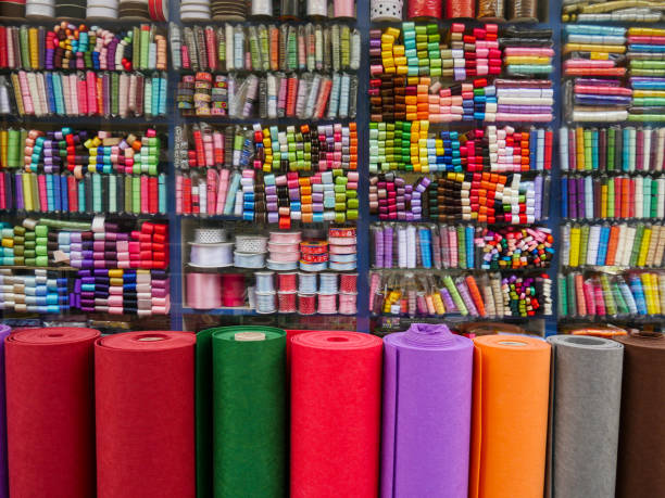 istock Fabric store with colorful ribbons on the shelf. 1211308631