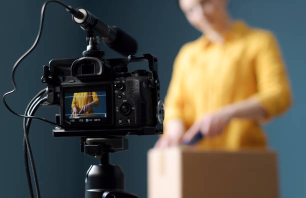 istock Vlogger making an unboxing video for her channel 1211309660
