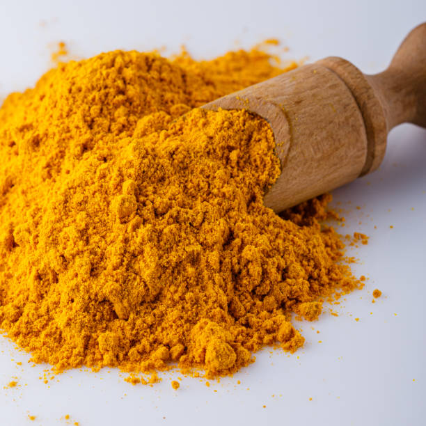 istock natural turmeric powder on white acrylic background 1211309757
