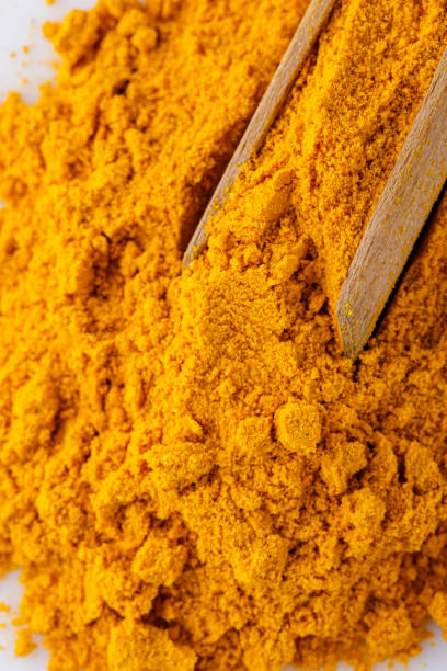 istock natural turmeric powder on white acrylic background 1211309835