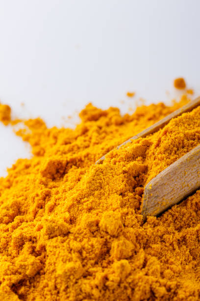 istock natural turmeric powder on white acrylic background 1211309844