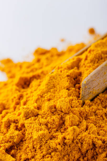 istock natural turmeric powder on white acrylic background 1211309866