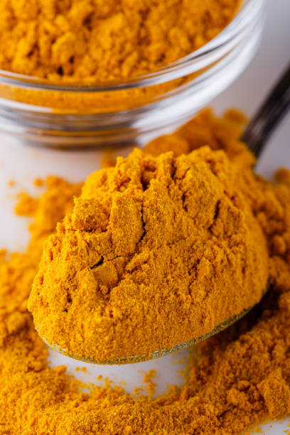 istock natural turmeric powder on white acrylic background 1211310491
