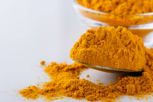 istock natural turmeric powder on white acrylic background 1211310583