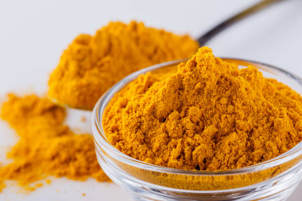 istock natural turmeric powder on white acrylic background 1211310659