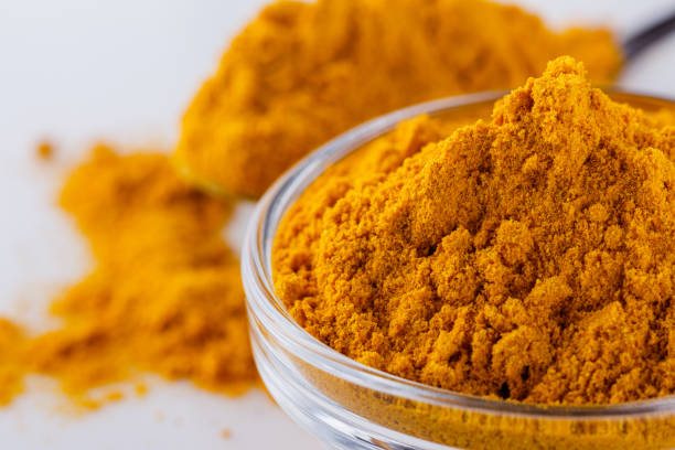 istock natural turmeric powder on white acrylic background 1211310701