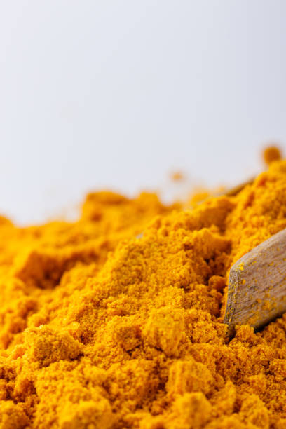 istock natural turmeric powder on white acrylic background 1211310739