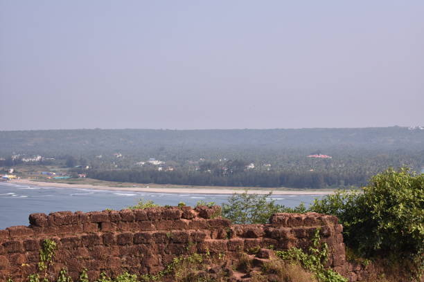 fort wall in goa, just beside the ocean unedited image of a fort wall just beside the sea chapora fort stock pictures, royalty-free photos & images