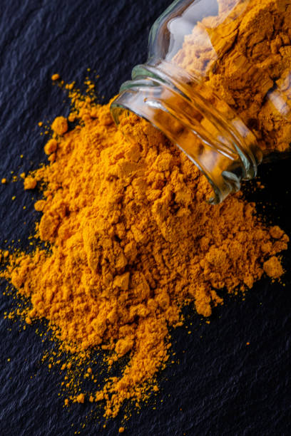 istock natural turmeric powder on a dark stone background 1211310833