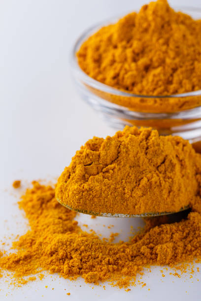 istock natural turmeric powder on white acrylic background 1211310888
