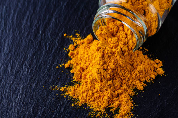 istock natural turmeric powder on a dark stone background 1211310996