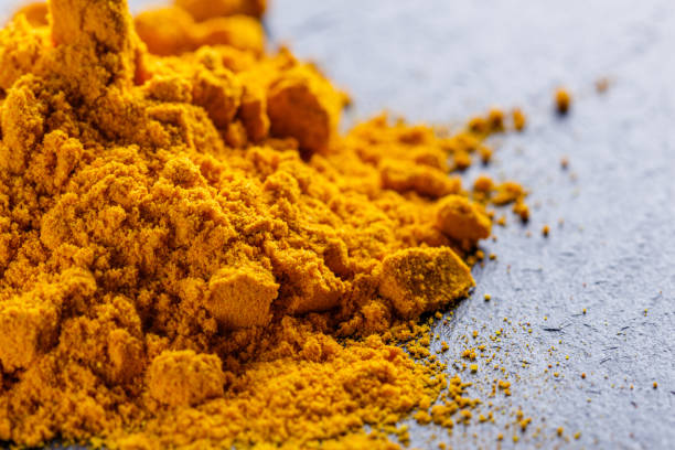 istock natural turmeric powder on a dark stone background 1211311042