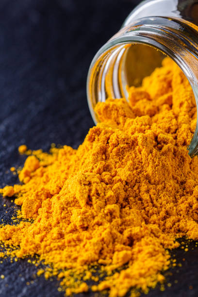 istock natural turmeric powder on a dark stone background 1211311047