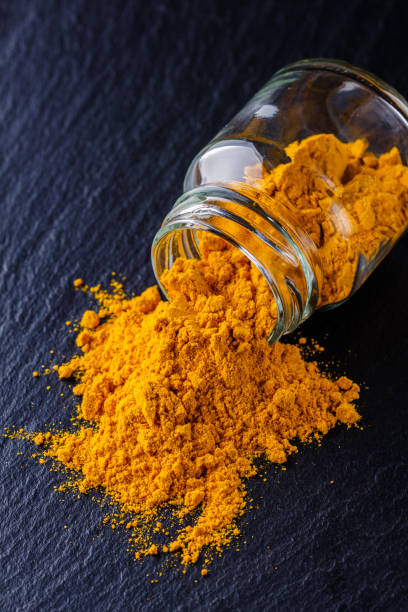istock natural turmeric powder on a dark stone background 1211311081