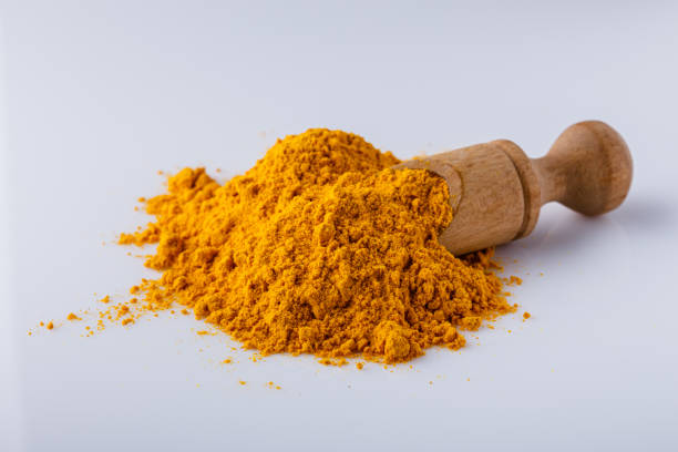 istock natural turmeric powder on white acrylic background 1211311104