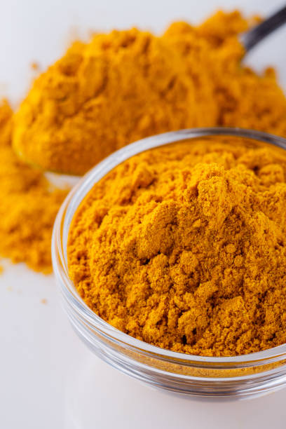 istock natural turmeric powder on white acrylic background 1211311131