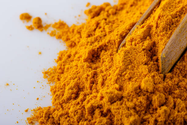istock natural turmeric powder on white acrylic background 1211311137
