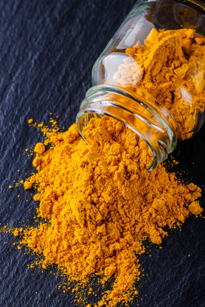istock natural turmeric powder on a dark stone background 1211311182