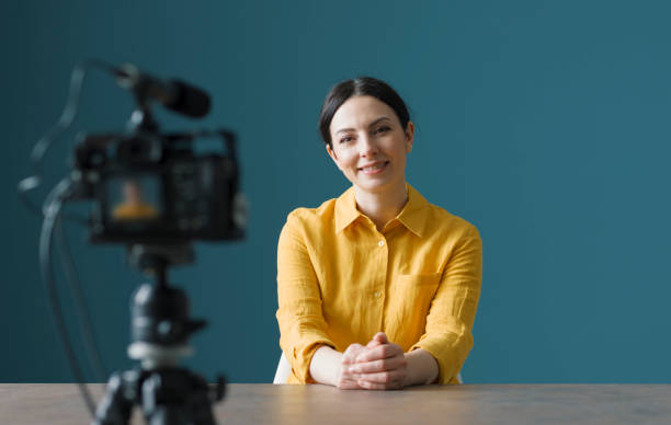 Professional vlogger sitting in front of a camera