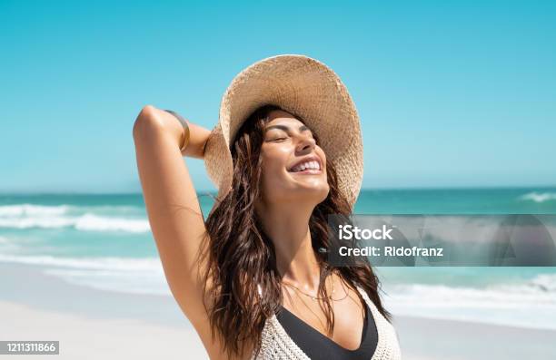 Stylish Casual Woman Enjoying Sun At Tropical Beach Stock Photo - Download Image Now