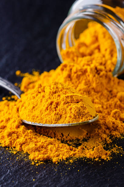 istock natural turmeric powder on a dark stone background 1211312521