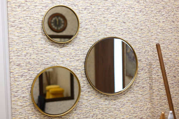 istock Three round mirrors on the wall in the hallway. 1211312540