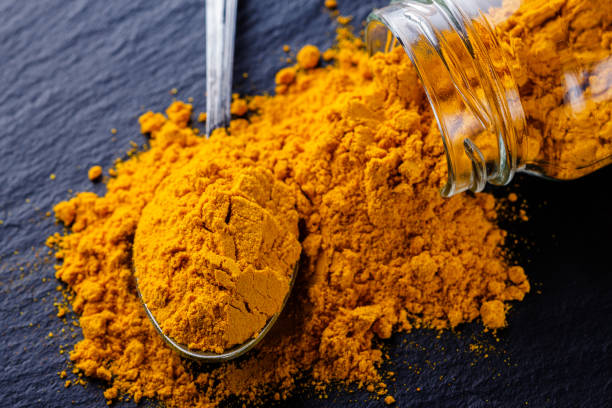 istock natural turmeric powder on a dark stone background 1211312553