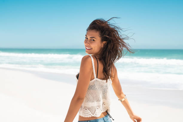istock Happy girl running on beach 1211312591